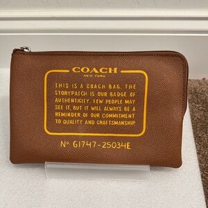 COACH storypatch Brown and Yellow Logo Zip Pouch